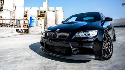 Black BMW in an industrial setting