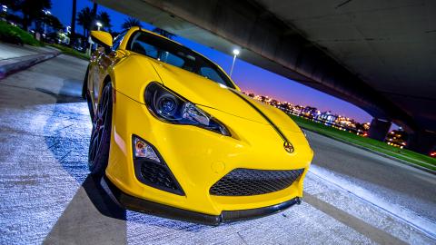 Close up of a Yellow FRS under a freeway overpass